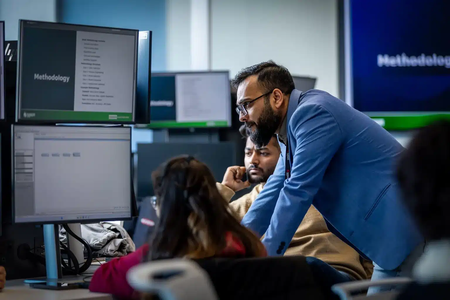 British business executive analyzing UK AI adoption data charts in a London office.