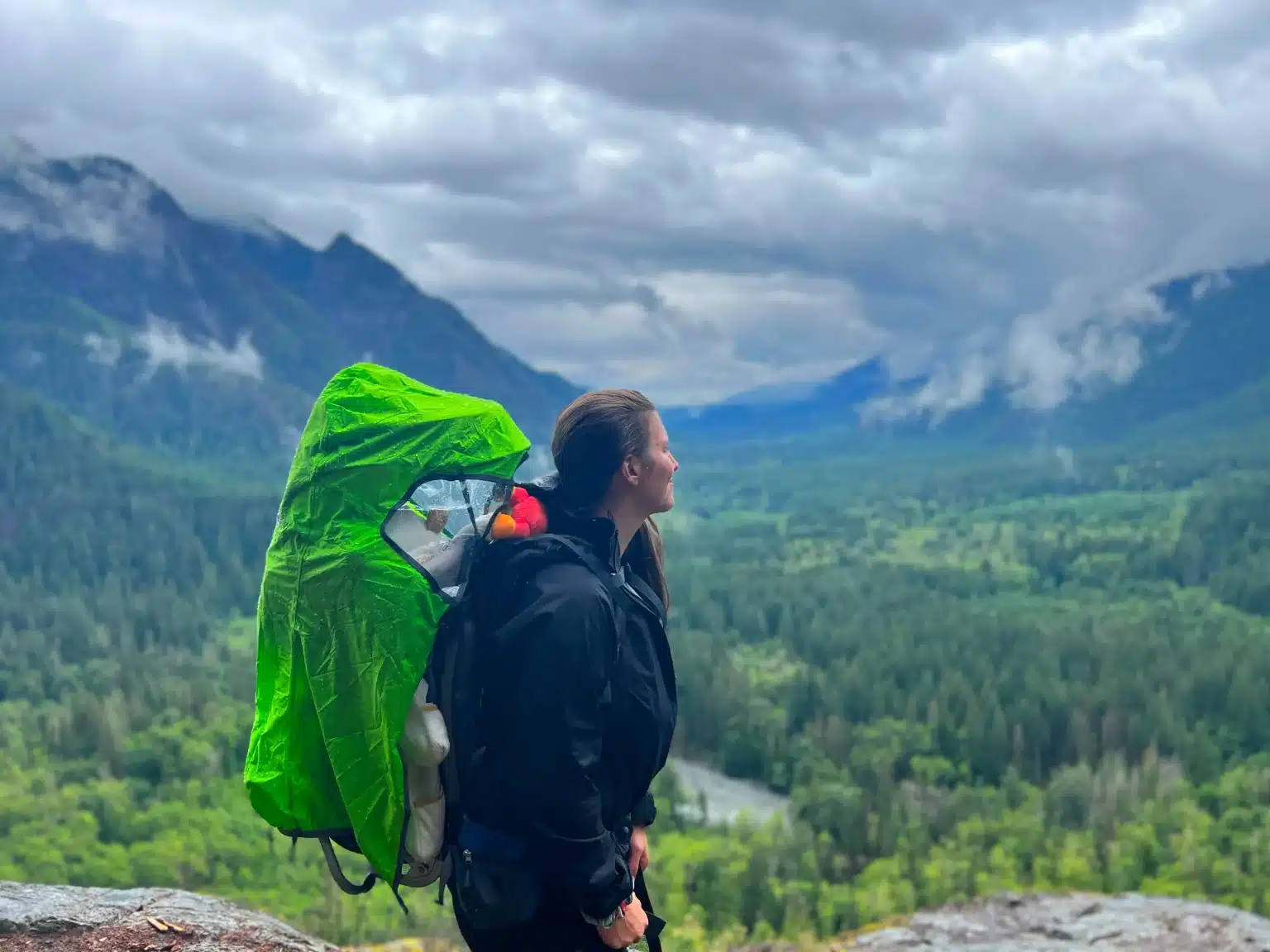 What to Wear Hiking | Preparing for Rain Hiker wearing layered waterproof clothing while walking in the rain - what to wear hiking