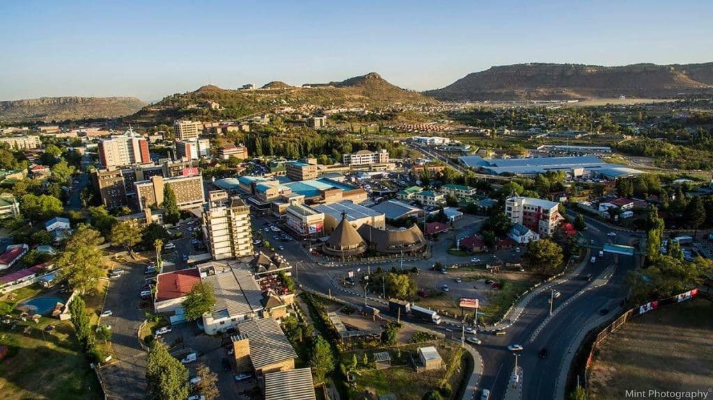 Lesotho Economy: Exports, Industries and Jobs Commercial buildings in Maseru with the Lesotho highlands in the background